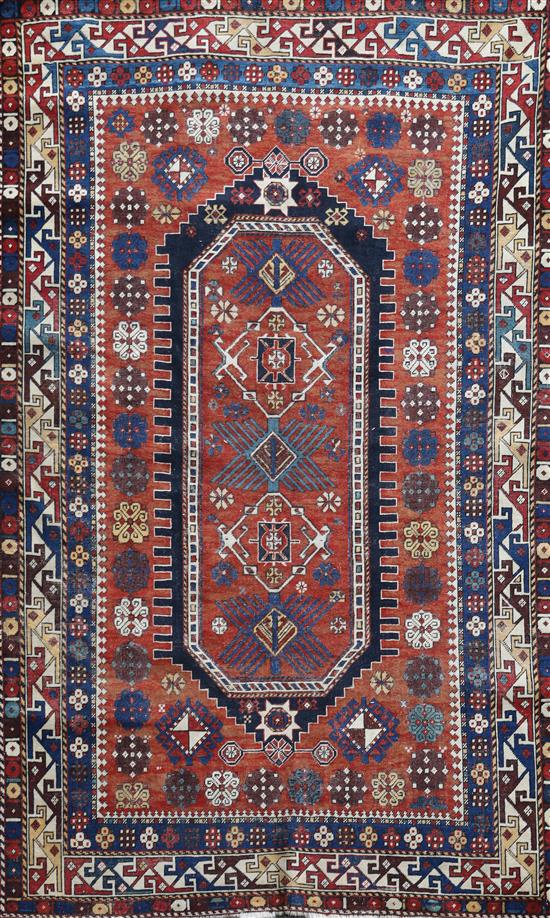 An antique Shirvan red ground rug, 6ft 9in by 4ft 5in.